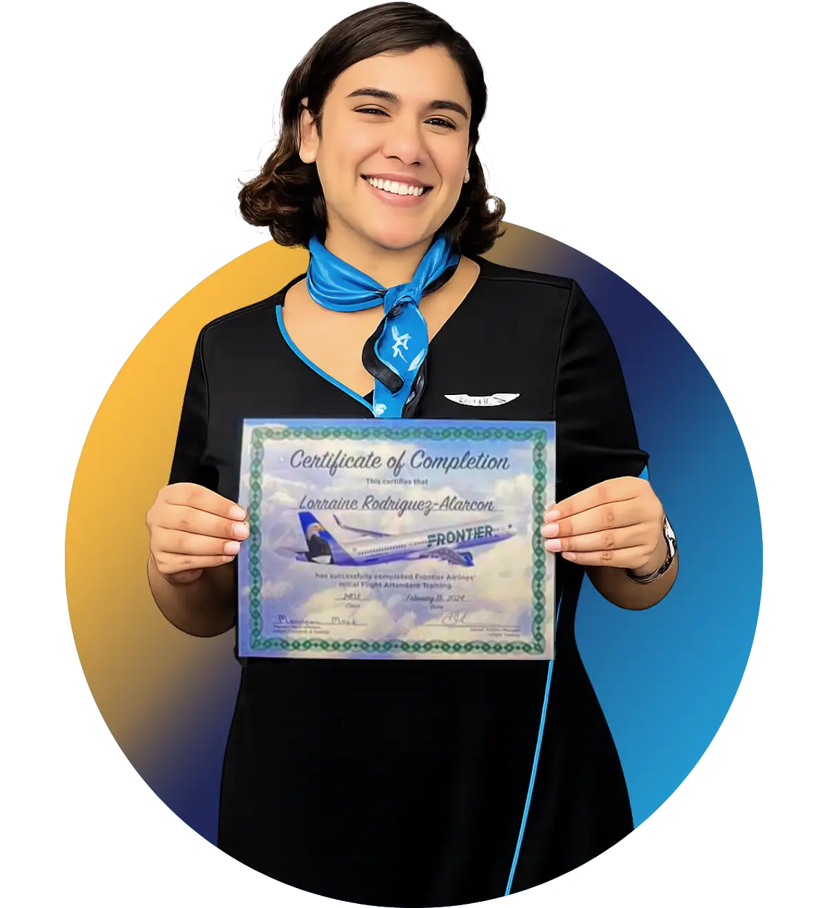 Triad Aviation Academy graduate proudly pointing at her airline wings pin