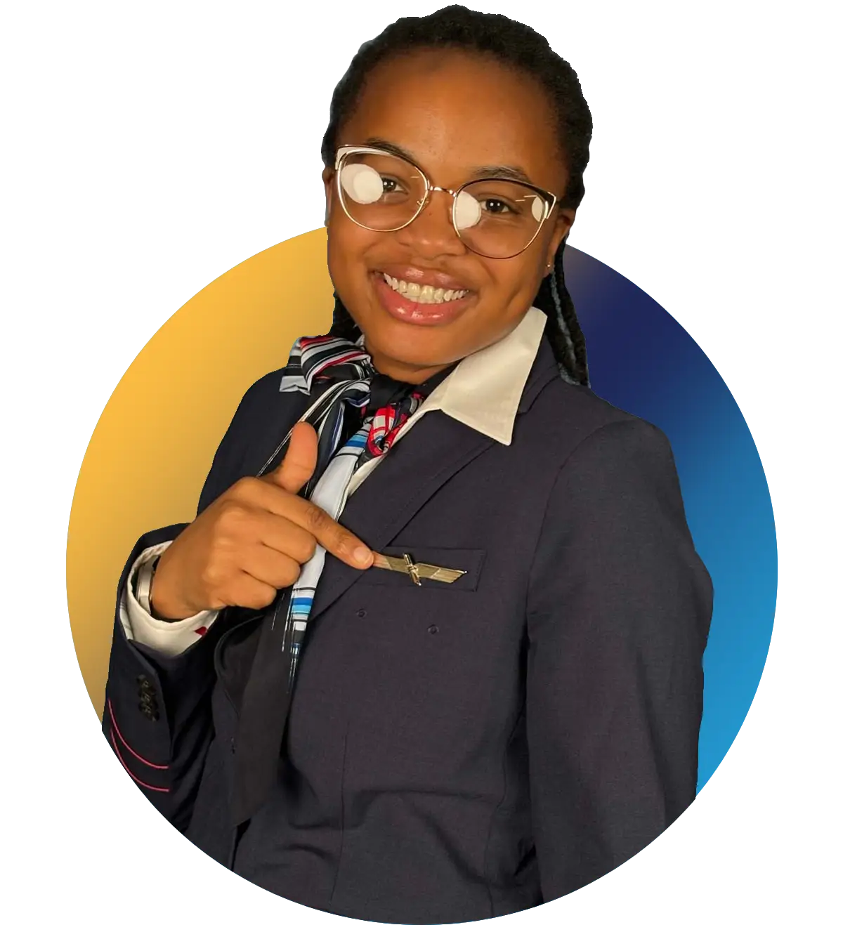Triad Aviation Academy graduate proudly pointing at her airline wings pin