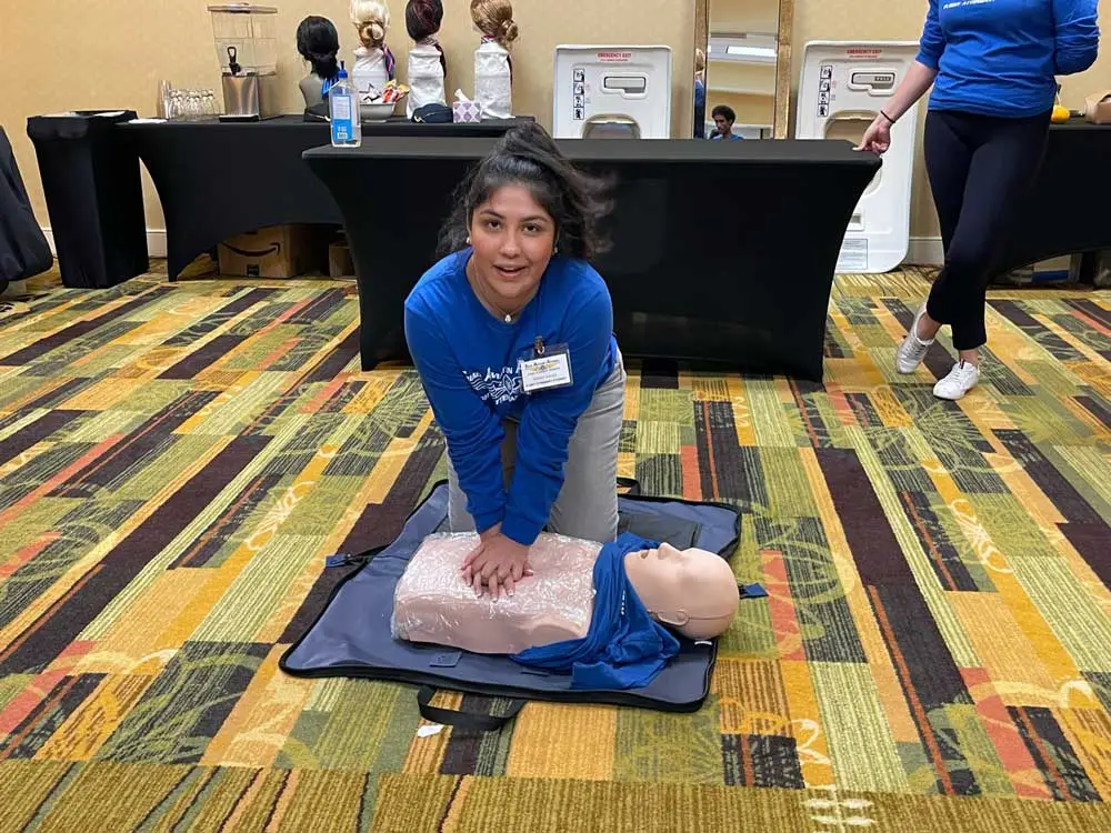 Flight attendant student practicing CPR