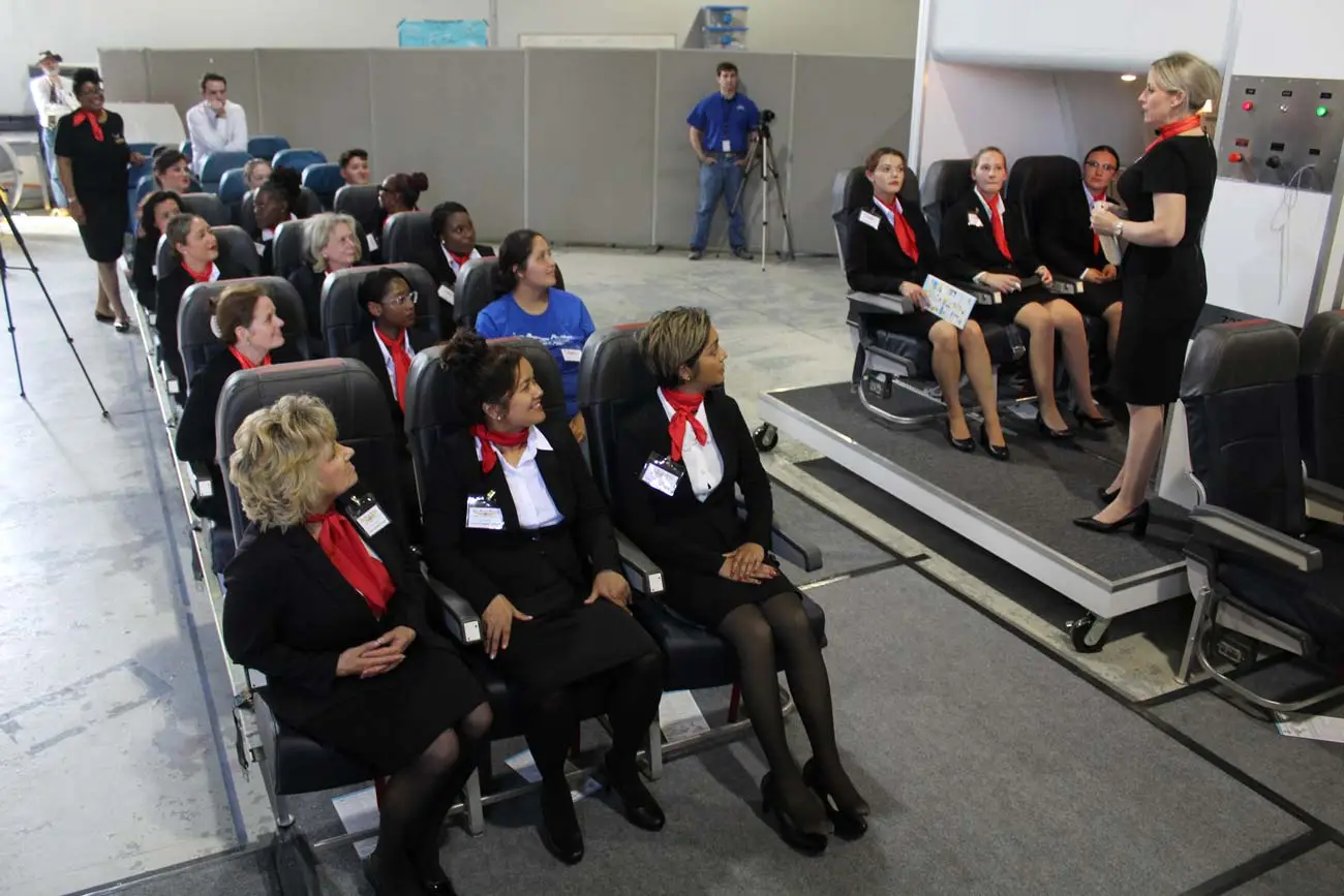 Flight attendant students training in the cabin trainer