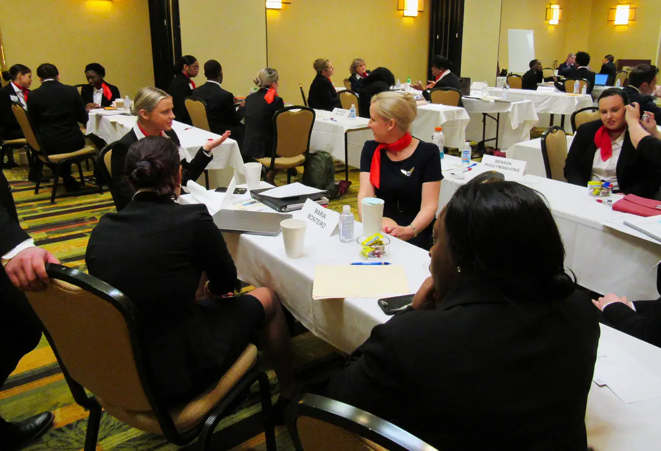 Flight attendant students in a classroom meeting