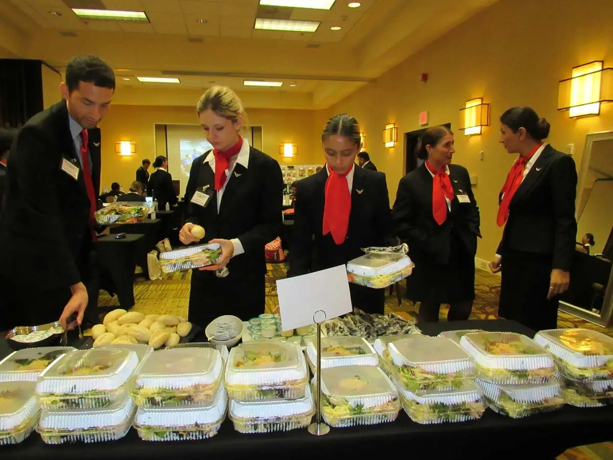 Flight attendant students in uniform at the buffet