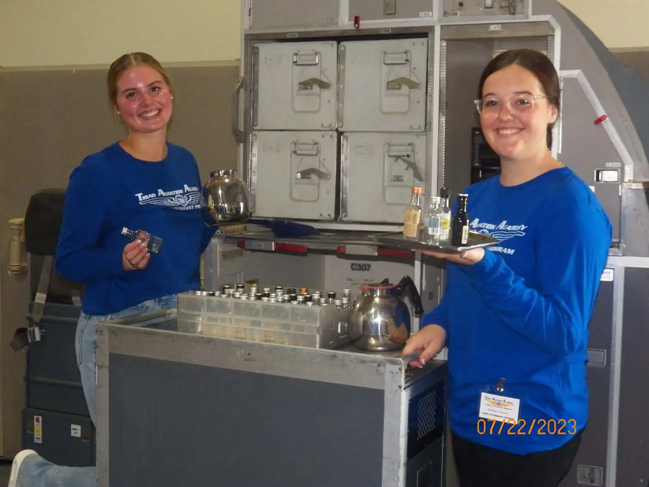Flight attendant students practicing beverage service